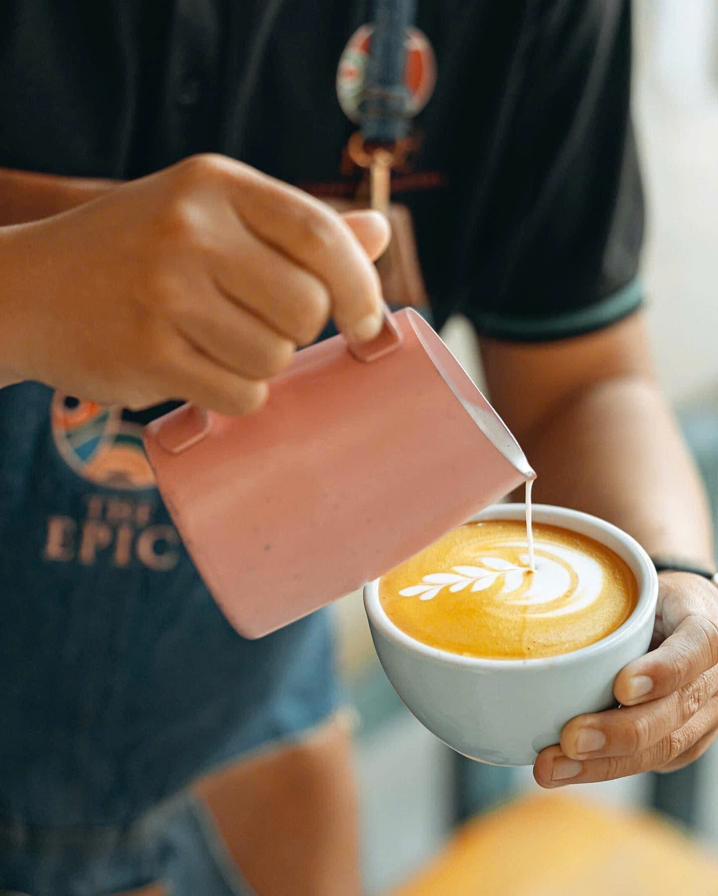 Barista pouring latte art
